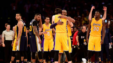 Former Duke basketball player Ryan Kelly embraces Kobe Bryant (Photo by Harry How/Getty Images)
