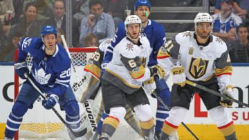 TORONTO, ON - NOVEMBER 6: Colin Miller #6 and Pierre-Edouard Bellemare #41 of the Vegas Golden Knights watch for an incoming shot along with Dominic Moore #20 and James van Riemsdyk #25 of the Toronto Maple Leafs during an NHL game at the Air Canada Centre on November 6, 2017 in Toronto, Ontario, Canada. The Maple Leafs defeated the Golden Knights 4-3 in an overtime shoot-out. (Photo by Claus Andersen/Getty Images)