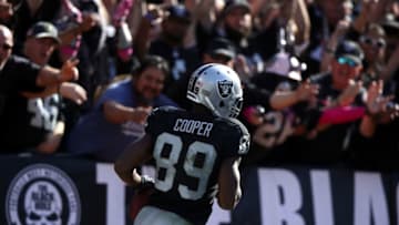 OAKLAND, CA - OCTOBER 09: Amari Cooper #89 of the Oakland Raiders scores a 64-yard touchdown against the San Diego Chargers during their NFL game at Oakland-Alameda County Coliseum on October 9, 2016 in Oakland, California. (Photo by Ezra Shaw/Getty Images)