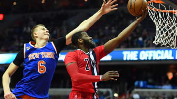 Nov 17, 2016; Washington, DC, USA; Washington Wizards guard John Wall (2) shoots a layup as New York Knicks forward Kristaps Porzingis (6) defends during the second half at Verizon Center. Mandatory Credit: Brad Mills-USA TODAY Sports