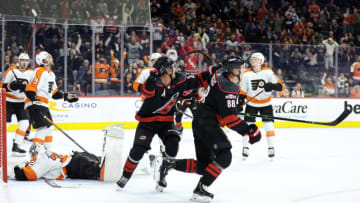 PHILADELPHIA, PENNSYLVANIA - MARCH 18: Sebastian Aho #20 and Martin Necas #88 of the Carolina Hurricanes celebrate a goal by Necas during the third period against the Philadelphia Flyers at Wells Fargo Center on March 18, 2023 in Philadelphia, Pennsylvania. (Photo by Tim Nwachukwu/Getty Images)