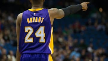 Dec 14, 2014; Minneapolis, MN, USA; Los Angeles Lakers guard Kobe Bryant (24) points during the third quarter against the Minnesota Timberwolves at Target Center. The Lakers defeated the Timberwolves 100-94. Mandatory Credit: Brace Hemmelgarn-USA TODAY Sports