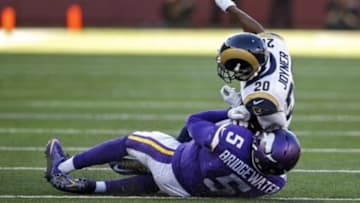 Nov 8, 2015; Minneapolis, MN, USA; St. Louis Rams cornerback Lamarcus Joyner (20) collides with Minnesota Vikings quarterback Teddy Bridgewater (5) for a personal foul in the fourth quarter at TCF Bank Stadium. Bridgewater did not return. The Vikings win 21-18. Mandatory Credit: Bruce Kluckhohn-USA TODAY Sports