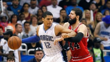 Apr 8, 2015; Orlando, FL, USA; Orlando Magic forward Tobias Harris (12) pushes back Chicago Bulls forward Nikola Mirotic (44) during an NBA basketball game at Amway Center. The Orlando Magic beat the Chicago Bulls 105-103. Mandatory Credit: Reinhold Matay-USA TODAY Sports