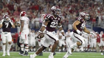 Sep 24, 2016; Dallas, TX, USA; Texas A&M Aggies defensive back Armani Watts (23) celebrates recovering a fumble on the one yard line against the Arkansas Razorbacks in the second quarter at AT&T Stadium. Mandatory Credit: Tim Heitman-USA TODAY Sports