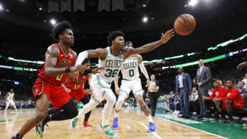 BOSTON, MASSACHUSETTS - FEBRUARY 07: Marcus Smart #36 of the Boston Celtics attempts to save the ball from going out of bounds during the fourth quarter of the game against the Atlanta Hawks at TD Garden on February 07, 2020 in Boston, Massachusetts. NOTE TO USER: User expressly acknowledges and agrees that, by downloading and or using this photograph, User is consenting to the terms and conditions of the Getty Images License Agreement. (Photo by Omar Rawlings/Getty Images)