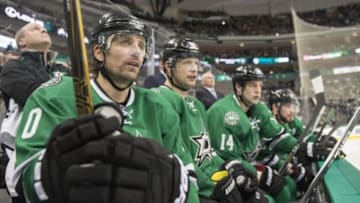 Dec 27, 2015; Dallas, TX, USA; Dallas Stars left wing Patrick Sharp (10) an center Jason Spezza (90) and left wing Jamie Benn (14) watch their team take on the St. Louis Blues during the third period at the American Airlines Center. Sharp and Benn each score goals. The Stars shut out the Blues 3-0. Mandatory Credit: Jerome Miron-USA TODAY Sports