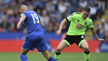 LEICESTER, ENGLAND - MAY 21: Islam Slimani of Leicester City and Dan Gosling of AFC Bournemouth battle for possession during the Premier League match between Leicester City and AFC Bournemouth at The King Power Stadium on May 21, 2017 in Leicester, England. (Photo by Ross Kinnaird/Getty Images)