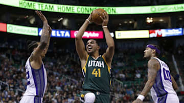 Dec 10, 2016; Salt Lake City, UT, USA; Utah Jazz forward Trey Lyles (41) drives to the hoop against Sacramento Kings forward Matt Barnes (22) and center Willie Cauley-Stein (00) in the second quarter at Vivint Smart Home Arena. Mandatory Credit: Jeff Swinger-USA TODAY Sports