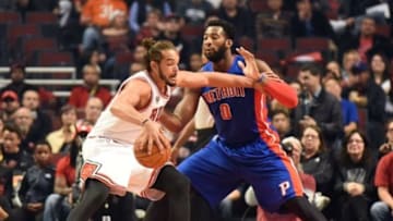 Oct 14, 2015; Chicago, IL, USA; Chicago Bulls center Joakim Noah (13) is defended by Detroit Pistons center Andre Drummond (0) during the first quarter at the United Center. Mandatory Credit: David Banks-USA TODAY Sports