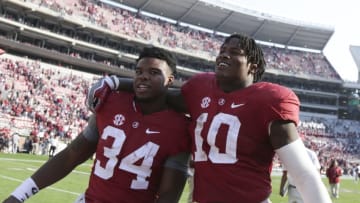 Nov 12, 2016; Tuscaloosa, AL, USA; Alabama Crimson Tide running back Damien Harris (34) and Alabama linebacker Reuben Foster (10) leave the field after his team defeated the Mississippi State Bulldogs at Bryant-Denny Stadium. The Tide defeated the Bulldogs 51-3. Mandatory Credit: Marvin Gentry-USA TODAY Sports