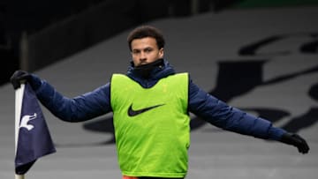 LONDON, ENGLAND - JANUARY 13: Dele Alli of Tottenham Hotspur warms up during the Premier League match between Tottenham Hotspur and Fulham at Tottenham Hotspur Stadium on January 13, 2021 in London, England. Sporting stadiums around England remain under strict restrictions due to the Coronavirus Pandemic as Government social distancing laws prohibit fans inside venues resulting in games being played behind closed doors. (Photo by Visionhaus)
