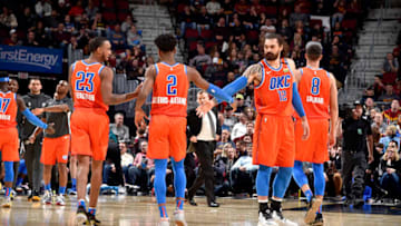JANUARY 4: Shai Gilgeous-Alexander #2 and Steven Adams #12 of OKC Thunder high five each other during a game against the Cleveland Cavaliers (Photo by David Liam Kyle/NBAE via Getty Images)