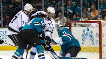 Apr 18, 2016; San Jose, CA, USA; Los Angeles Kings center Anze Kopitar (11) tries to get the puck in goal as San Jose Sharks goalie Martin Jones (31) and defenseman Marc-Edouard Vlasic (44) defend in the first period of game three in the first round of the 2016 Stanley Cup Playoffs at SAP Center at San Jose. Mandatory Credit: John Hefti-USA TODAY Sports