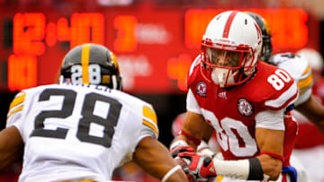 LINCOLN, NE - NOVEMBER 25: Wide receiver Kenny Bell #80 of the Nebraska Cornhuskers tries to avoid defensive back Shaun Prater #28 of the Iowa Hawkeyes during their game at Memorial Stadium November 25, 2011 in Lincoln, Nebraska. Nebraska defeated Iowa 20-7. (Photo by Eric Francis/Getty Images)