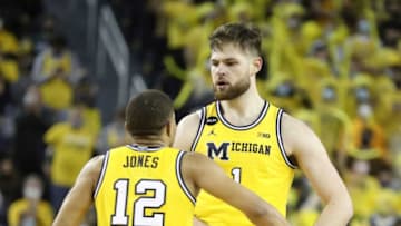 Michigan Wolverines center Hunter Dickinson (1) celebrates with guard DeVante' Jones (12) after scoring against the Michigan State Spartans during second half action Tuesday, Mar.1, 2022 at the Crisler Center.Michigan Msu