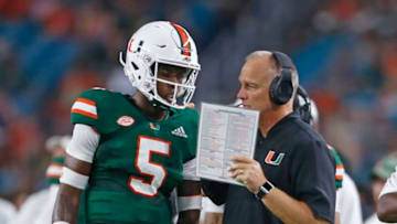 MIAMI GARDENS, FL - SEPTEMBER 8: Head coach Mark Richt talks to N'Kosi Perry #5 of the Miami Hurricanes during a break in action against the Savannah State Tigers on September 8, 2018 at Hard Rock Stadium in Miami Gardens, Florida. Miami defeated Savannah State 77-0. (Photo by Joel Auerbach/Getty Images)