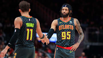ATLANTA, GA - NOVEMBER 25: Trae Young #11 slaps hands with DeAndre' Bembry #95 of the Atlanta Hawks during a game against the Minnesota Timberwolves at State Farm Arena on November 25, 2019 in Atlanta, Georgia. NOTE TO USER: User expressly acknowledges and agrees that, by downloading and or using this photograph, User is consenting to the terms and conditions of the Getty Images License Agreement. (Photo by Carmen Mandato/Getty Images)