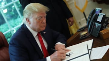 WASHINGTON, DC - JUNE 24: U.S. President Donald Trump signs an executive order imposing new sanctions on Iran, in the Oval Office at the White House on June 24, 2019 in Washington, DC. (Photo by Mark Wilson/Getty Images)