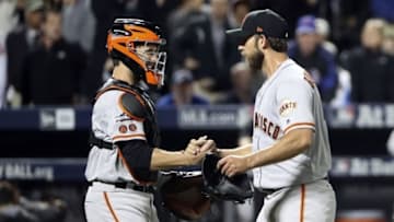 Oct 5, 2016; New York City, NY, USA; San Francisco Giants starting pitcher Madison Bumgarner (right) and catcher Buster Posey (left) celebrate the win against the New York Mets in the National League wild card playoff baseball game at Citi Field. Mandatory Credit: Anthony Gruppuso-USA TODAY Sports