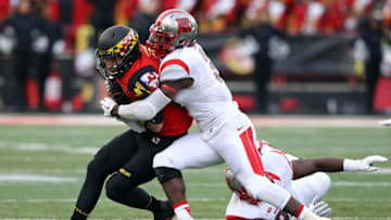 Nov 29, 2014; College Park, MD, USA; Maryland Terrapins quarterback C.J. Brown (16) scrambles before being tackled by Rutgers Scarlet Knights linebacker Steve Longa (3) at Byrd Stadium. Mandatory Credit: Mitch Stringer-USA TODAY Sports