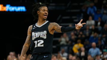 Nov 25, 2022; Memphis, Tennessee, USA; Memphis Grizzlies guard Ja Morant (12) reacts during the first quarter against the New Orleans Pelicans at FedExForum. Mandatory Credit: Petre Thomas-USA TODAY Sports