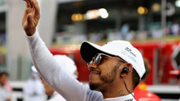 ABU DHABI, UNITED ARAB EMIRATES - NOVEMBER 26: Lewis Hamilton of Great Britain and Mercedes GP on the grid before the Abu Dhabi Formula One Grand Prix at Yas Marina Circuit on November 26, 2017 in Abu Dhabi, United Arab Emirates. (Photo by Mark Thompson/Getty Images)