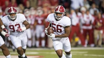 Oct 8, 2016; Fayetteville, AR, USA; Alabama Crimson Tide linebacker Tim Williams (56) returns a fumble by Arkansas Razorbacks quarterback Austin Allen (not pictured) for a touchdown as defensive lineman Jonathan Allen (93) trails the play during the second quarter at Donald W. Reynolds Razorback Stadium. Mandatory Credit: Brett Rojo-USA TODAY Sports