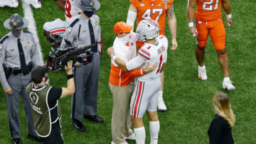 Jan 1, 2021; New Orleans, LA, USA; Clemson Tigers head coach Dabo Swinney talks with Ohio State Buckeyes quarterback Justin Fields (1) after the game at Mercedes-Benz Superdome. The Ohio State Buckeyes won 49-28. Mandatory Credit: Russell Costanza-USA TODAY Sports