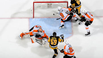 PITTSBURGH, PA - OCTOBER 29: Jake Guentzel #59 of the Pittsburgh Penguins scores past Brian Elliott #37 of the Philadelphia Flyers at PPG PAINTS Arena on October 29, 2019 in Pittsburgh, Pennsylvania. (Photo by Joe Sargent/NHLI via Getty Images)
