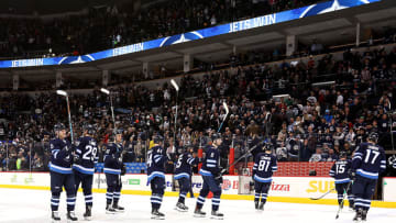 WINNIPEG, MB - JANUARY 5: Winnipeg Jets players salute the fans as they leave the ice following a 4-3 victory over the Buffalo Sabres at the Bell MTS Place on January 5, 2018 in Winnipeg, Manitoba, Canada. (Photo by Darcy Finley/NHLI via Getty Images)