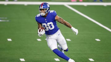 Oct 11, 2020; Arlington, Texas, USA; New York Giants tight end Evan Engram (88) runs a reverse for a touchdown in the first quarter against the Dallas Cowboys at AT&T Stadium. Mandatory Credit: Tim Heitman-USA TODAY Sports