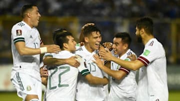 Defender Héctor Moreno (No. 15) is mobbed by El tri teammates after scoring off a corner kick i minute 30. (Photo by MARVIN RECINOS/AFP via Getty Images)