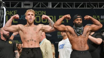 CLEVELAND, OHIO - AUGUST 28: Jake Paul and Tyron Woodley pose during the weigh in event at the State Theater prior to their August 29 fight on August 28, 2021 in Cleveland, Ohio. (Photo by Jason Miller/Getty Images)