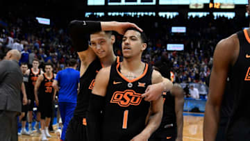 LAWRENCE, KS - FEBRUARY 3: Kendall Smith #1 and Lindy Waters III #21 of the Oklahoma State Cowboys celebrate a 84-79 win over Kansas Jayhawks at Allen Fieldhouse on February 3, 2018 in Lawrence, Kansas. (Photo by Ed Zurga/Getty Images)