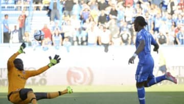 Sep 26, 2015; Montreal, Quebec, CAN; Montreal Impact forward Didier Drogba (11) scores a goal against D.C. United goalkeeper Bill Hamid (28) during the first half at Stade Saputo. Mandatory Credit: Eric Bolte-USA TODAY Sports