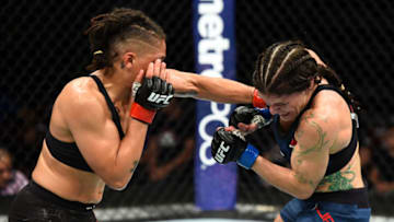 UTICA, NY - JUNE 01: (L-R) Sijara Eubanks punches Lauren Murphy in their women's flyweight fight during the UFC Fight Night event at the Adirondack Bank Center on June 1, 2018 in Utica, New York. (Photo by Josh Hedges/Zuffa LLC/Zuffa LLC via Getty Images)