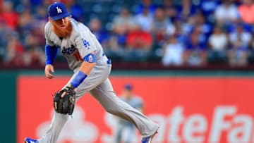 ARLINGTON, TX - AUGUST 28: Justin Turner #10 of the Los Angeles Dodgers fields a ground ball hit by Jurickson Profar #19 of the Texas Rangers in the bottom of the second inning at Globe Life Park in Arlington on August 28, 2018 in Arlington, Texas. (Photo by Tom Pennington/Getty Images)