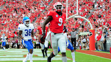 ATHENS, GA - SEPTEMBER 15: Jeremiah Holloman #9 of Georgia football makes a catch for a touchdown against the Middle Tennessee Blue Raiders on September 15, 2018 at Sanford Stadium in Athens, Georgia. (Photo by Scott Cunningham/Getty Images)