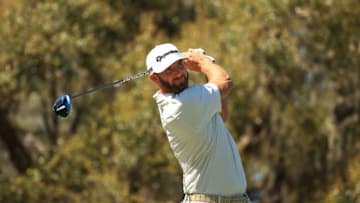 BRADENTON, FLORIDA - FEBRUARY 25: Dustin Johnson of the United States plays his shot from the 15th tee during the first round of World Golf Championships-Workday Championship at The Concession on February 25, 2021 in Bradenton, Florida. (Photo by Mike Ehrmann/Getty Images)