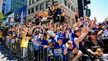 OAKLAND, CA - JUNE 12: Golden State Warriors fans cheer during the Victory Parade on June 12, 2018 in Oakland, California. The Golden State Warriors beat the Cleveland Cavaliers 4-0 to win the 2018 NBA Finals. NOTE TO USER: User expressly acknowledges and agrees that, by downloading and or using this photograph, user is consenting to the terms and conditions of Getty Images License Agreement. Mandatory Copyright Notice: Copyright 2018 NBAE (Photo by Jack Arent/NBAE via Getty Images)