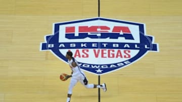 Jul 25, 2013; Las Vegas, NV, USA; USA White Team guard Paul George dribbles the ball through mid-court during the opening minutes of the 2013 USA Basketball Showcase at the Thomas and Mack Center. Team White won the game 128-106. Mandatory Credit: Stephen R. Sylvanie-USA TODAY Sports