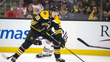 BOSTON - SEPTEMBER 28: Boston Bruins center Par Lindholm (26) handles the puck during the second period. The Boston Bruins host the Chicago Blackhawks in their final pre-season NHL hockey game at TD Garden in Boston on Sep. 28, 2019. (Photo by Nic Antaya for The Boston Globe via Getty Images)