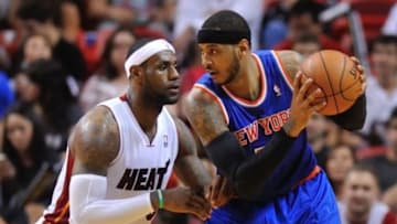 Apr 6, 2014; Miami, FL, USA; New York Knicks forward Carmelo Anthony (7) is pressured by Miami Heat forward LeBron James (6) during the second half at American Airlines Arena. Miami won 102-91. Mandatory Credit: Steve Mitchell-USA TODAY Sports