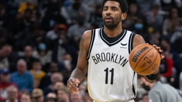 Jan 5, 2022; Indianapolis, Indiana, USA; Brooklyn Nets guard Kyrie Irving (11) dribbles the ball in the second half against the Indiana Pacers at Gainbridge Fieldhouse. Mandatory Credit: Trevor Ruszkowski-USA TODAY Sports
