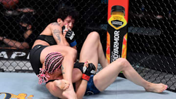 LAS VEGAS, NEVADA - AUGUST 15: (L-R) Virna Jandiroba of Brazil secures an arm bar submission against Felice Herrig in their strawweight bout during the UFC 252 event at UFC APEX on August 15, 2020 in Las Vegas, Nevada. (Photo by Jeff Bottari/Zuffa LLC)