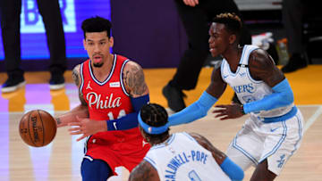 Mar 25, 2021; Los Angeles, California, USA; Philadelphia 76ers forward Danny Green (14) is defended by Los Angeles Lakers guard Kentavious Caldwell-Pope (1) and guard Dennis Schroder (17) in the first half of the game at Staples Center. Mandatory Credit: Jayne Kamin-Oncea-USA TODAY Sports