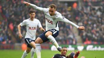 LONDON, ENGLAND - MARCH 03: Christian Eriksen of Tottenham Hotspur evades Rajiv van La Parra of Huddersfield Town during the Premier League match between Tottenham Hotspur and Huddersfield Town at Wembley Stadium on March 3, 2018 in London, England. (Photo by Michael Regan/Getty Images)