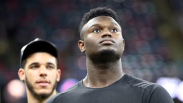 Zion Williamson (front) and Lonzo Ball of the New Orleans Pelicans walk on the field before the game between the New Orleans Saints and the Houston Texans (Photo by Chris Graythen/Getty Images)