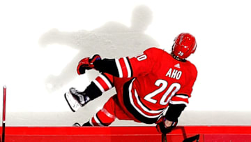 RALEIGH, NC - OCTOBER 27: Sebastian Aho #20 of the Carolina Hurricanes leaps over the boards to enter the ice against the St. Louis Blues during an NHL game on October 27, 2017 at PNC Arena in Raleigh, North Carolina. (Photo by Gregg Forwerck/NHLI via Getty Images)
